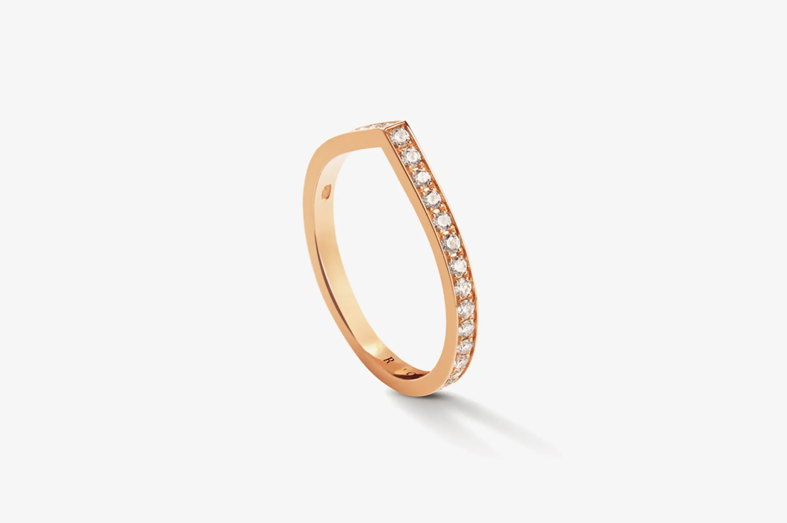 <p>A reinvention of the wedding band, Repossi’s Antifer ring in 18K yellow gold with diamonds is simple yet striking.</p>