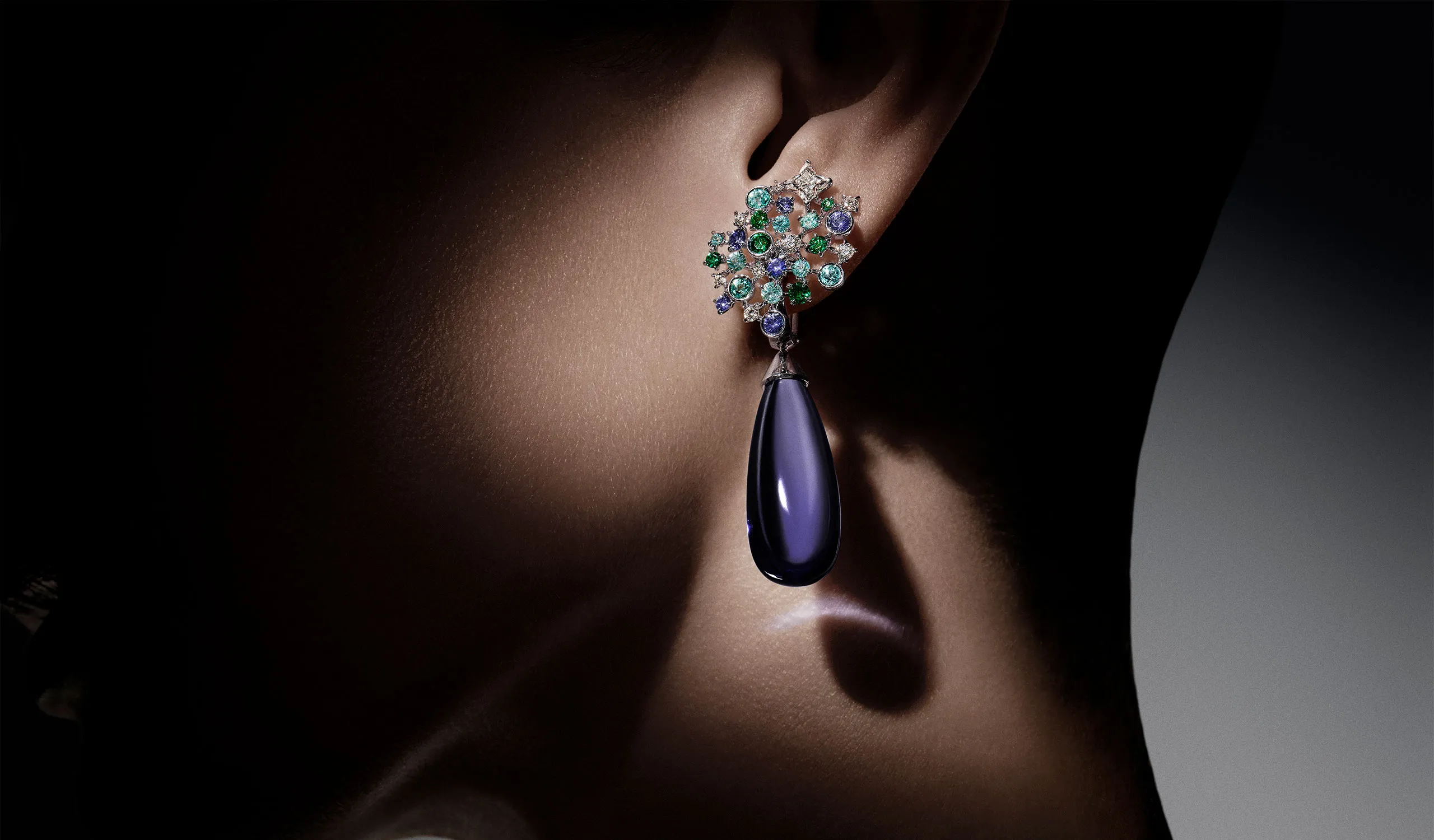 <p>Sirius cabochon tanzanite, aquamarine, emerald, tourmaline and diamond high jewellery earrings</p>
