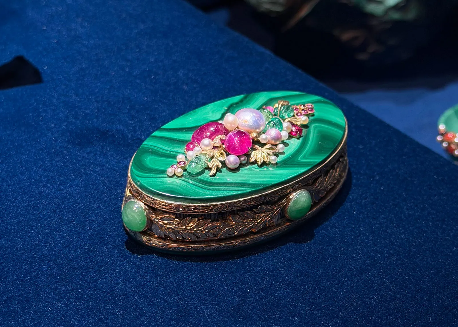 <p>An ornate malachite and gem-set decorative box</p>