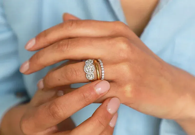 Sophie Breitmeyer D Shaped wedding ring in 18K yellow gold. “In an age of abundance, the plain gold band appeals in its simplicity,” she says