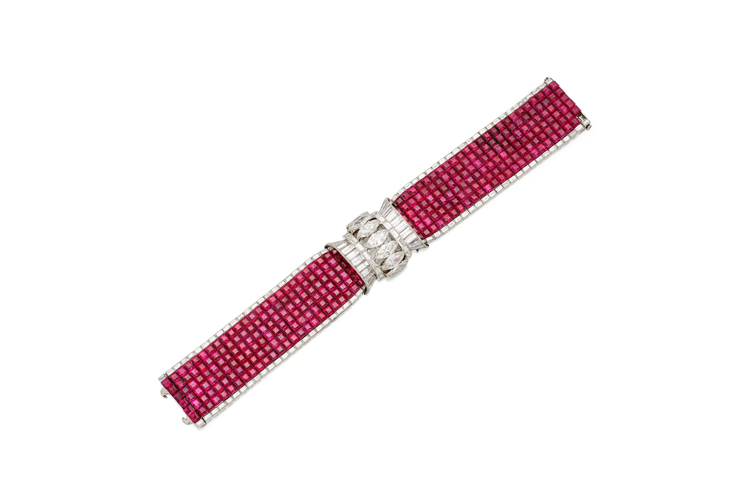 <p>Cartier bracelet displayed open in a flexible strap of calibré-cut rubies bordered by baguette diamonds, with a central row of marquise-shaped diamonds set between straight and tapered baguette diamonds</p>