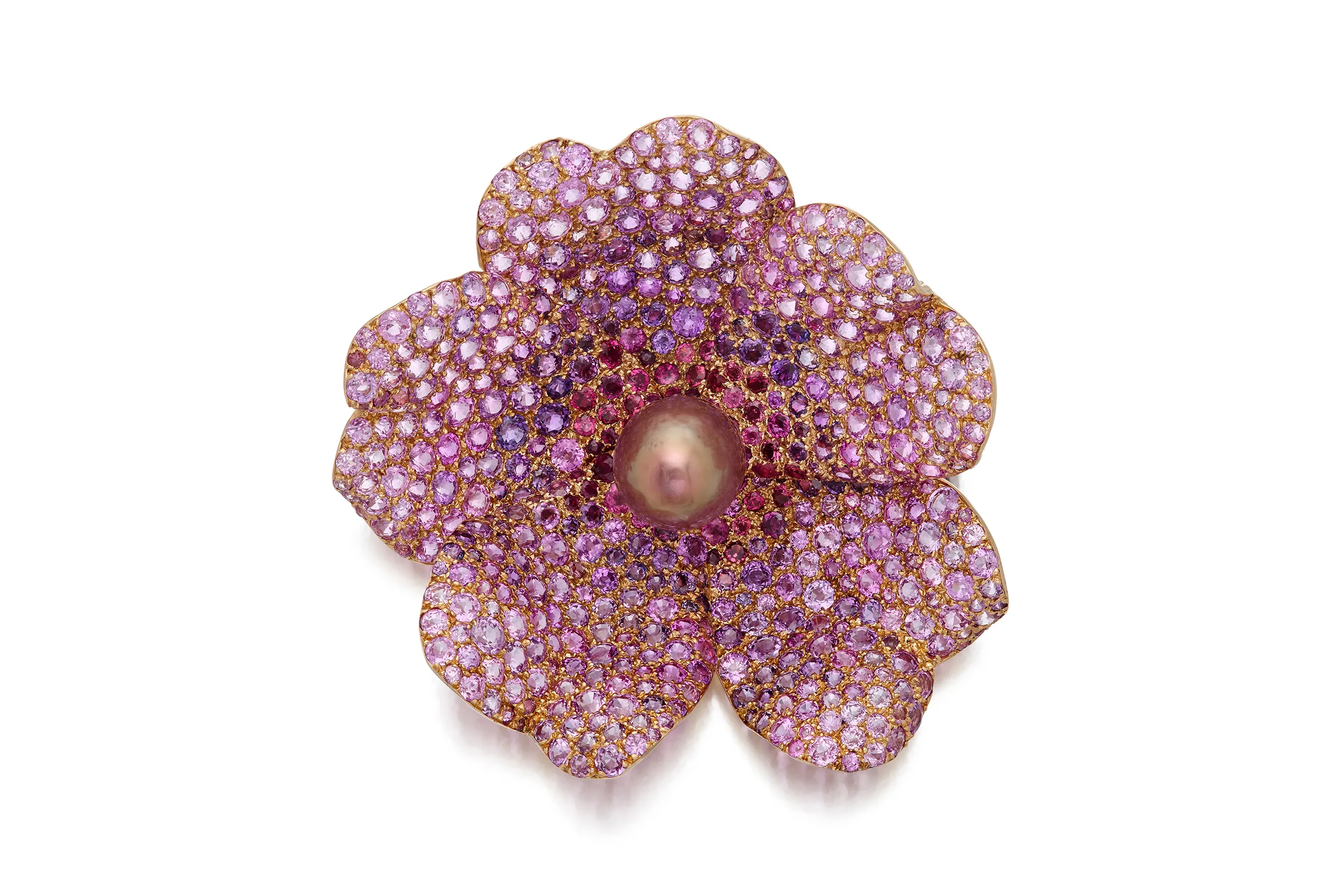 <p>JAR wild rose clip-brooch featuring an ovoid natural pearl center with pavé-set pink and purple sapphires and garnets</p>