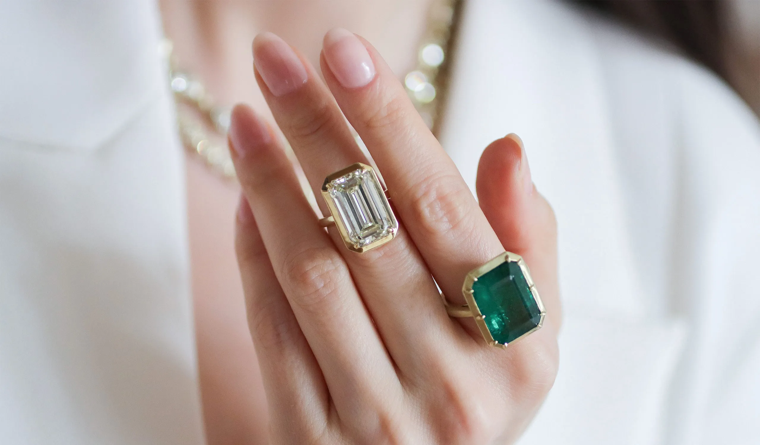<p>New emerald-cut diamond and emerald rings by Sylva &amp; Cie, showcased in Georgian-inspired collet settings</p>
