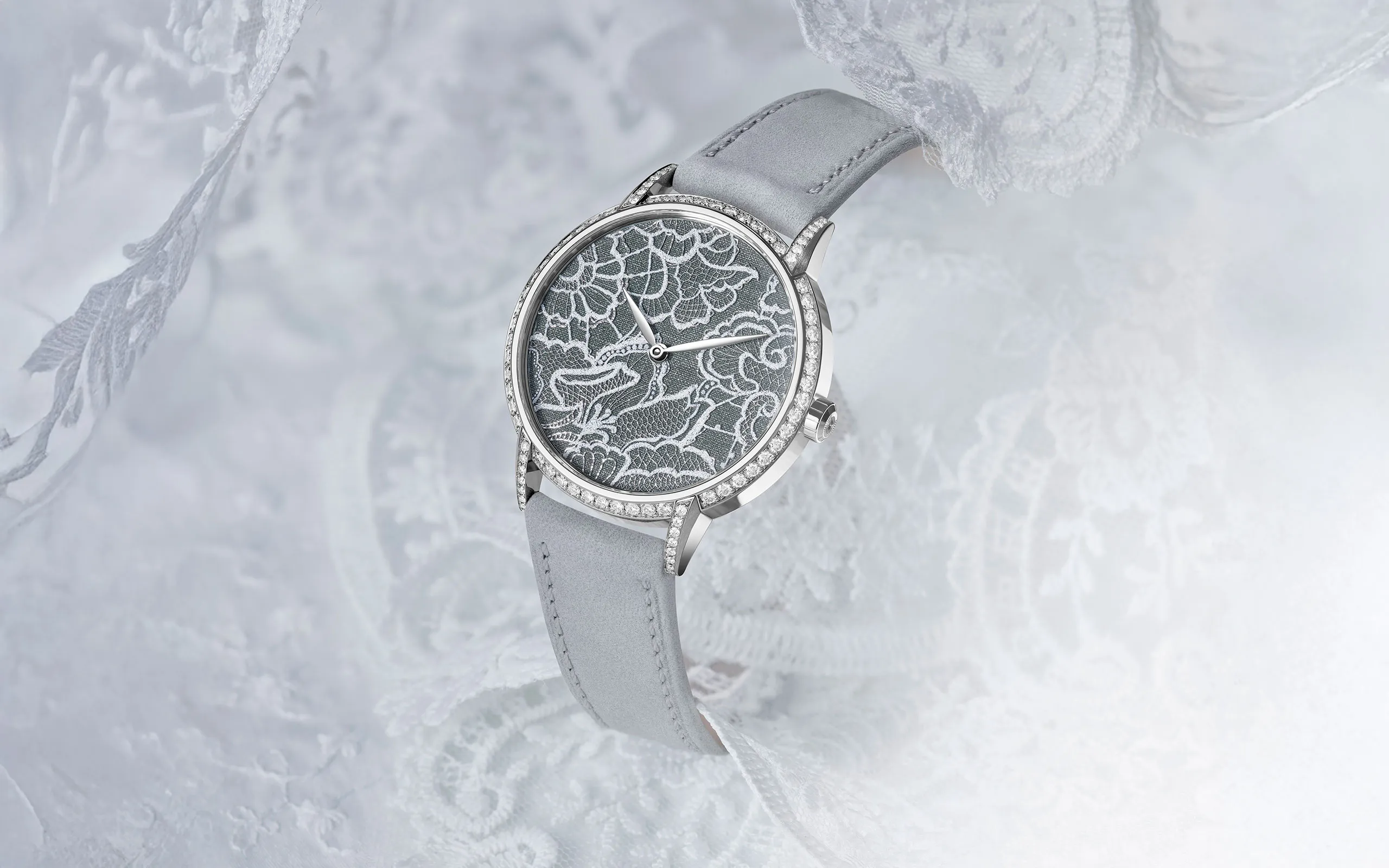 <p>TAOS Dentelle timepiece inspired by Swiss lace with hand-engraving, enamel and a fine silver paillon mesh to recreate the texture of fabric </p>

