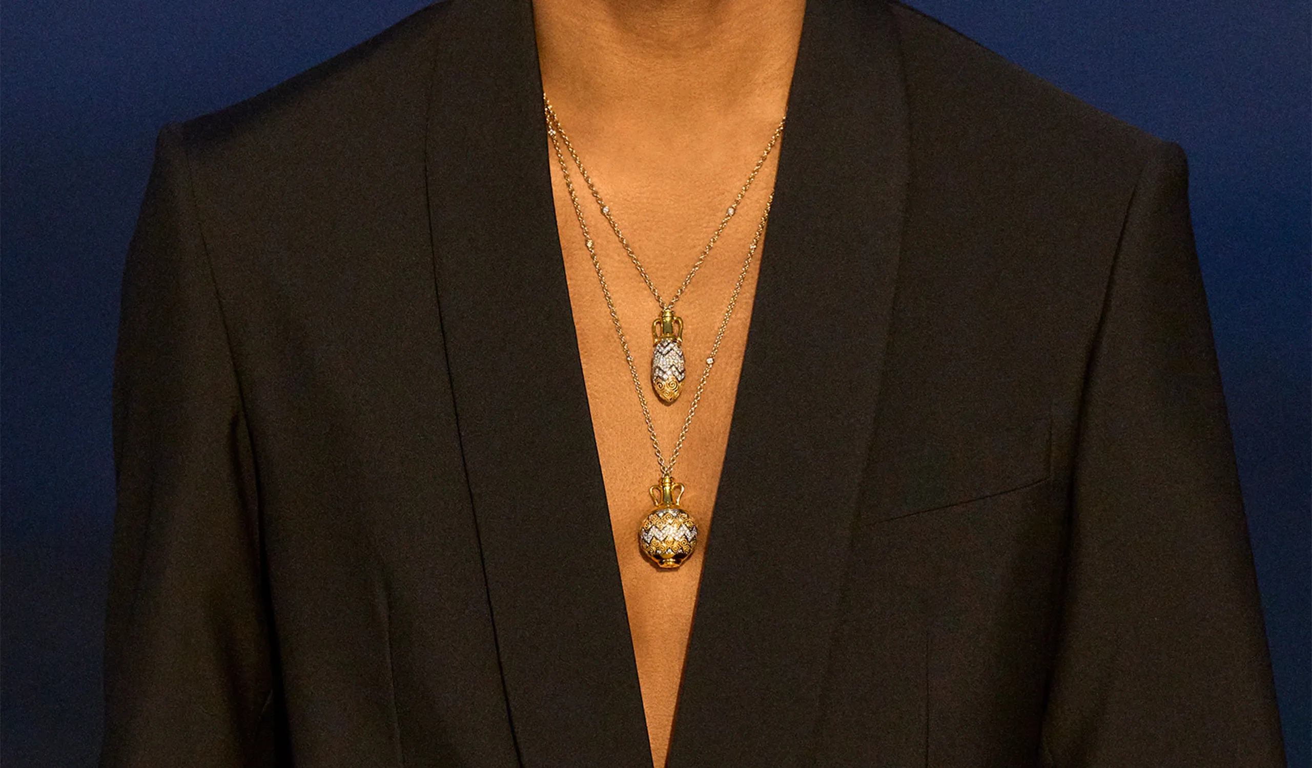 <p>Layered Totem pendants in 18k white and yellow gold with diamonds, worn with the matching ear cuff</p>
