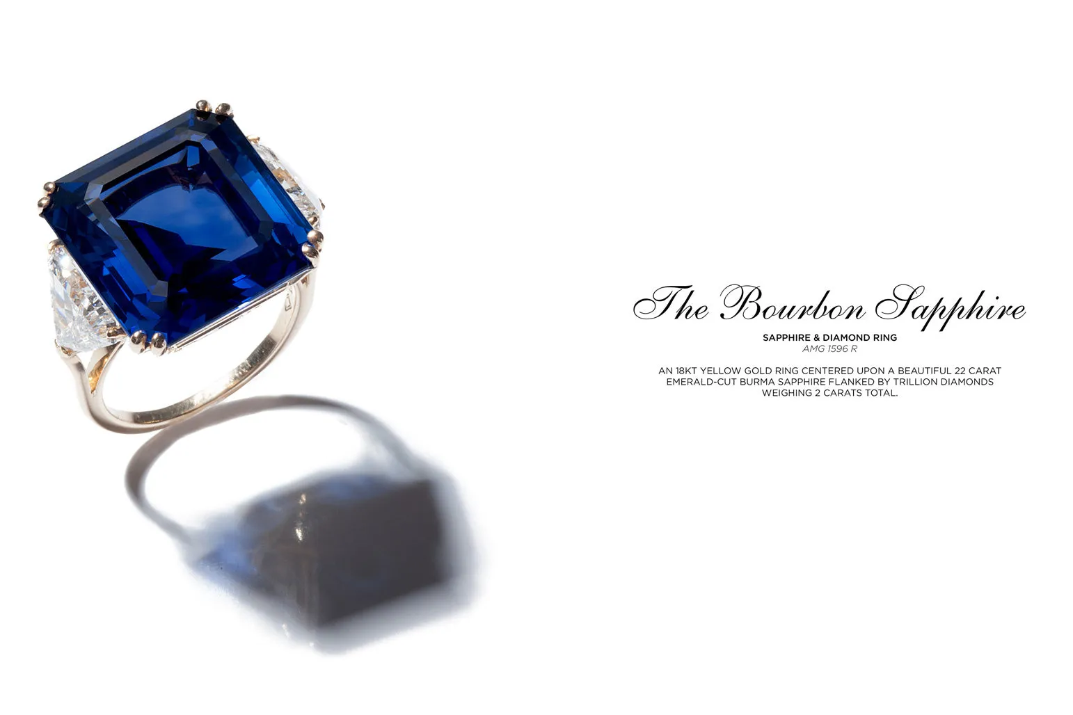 <p>The Bourbon Sapphire &#8211; An 18kt yellow gold ring centered upon a beautiful 22 carat emerald-cut Burma sapphire flanked by trillion diamonds weighing 2 carats total</p>
