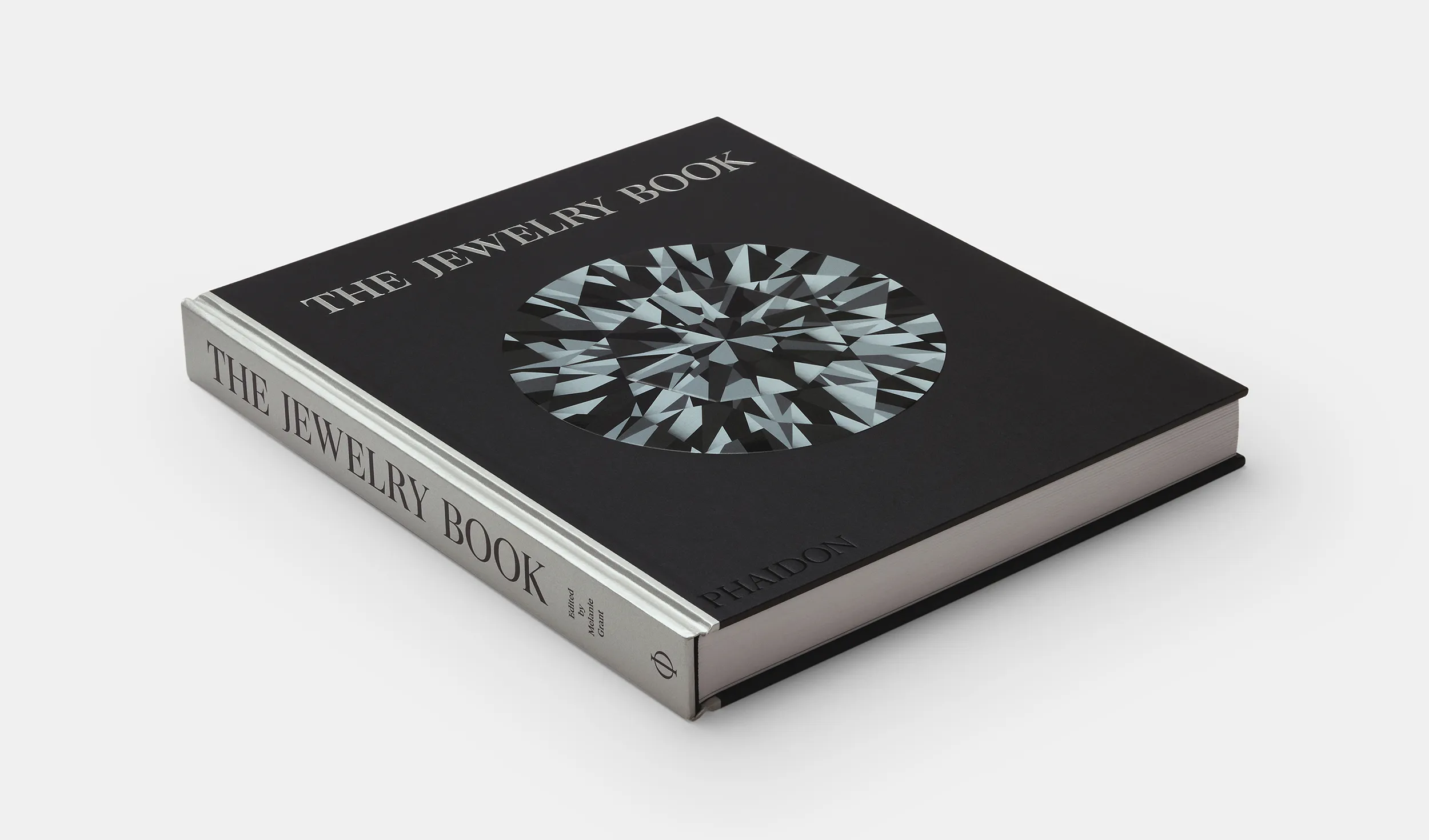 <p><em>The Jewelry Book</em> is designed as a gorgeous object in its own right, with a cover featuring a faceted deboss diamond</p>
