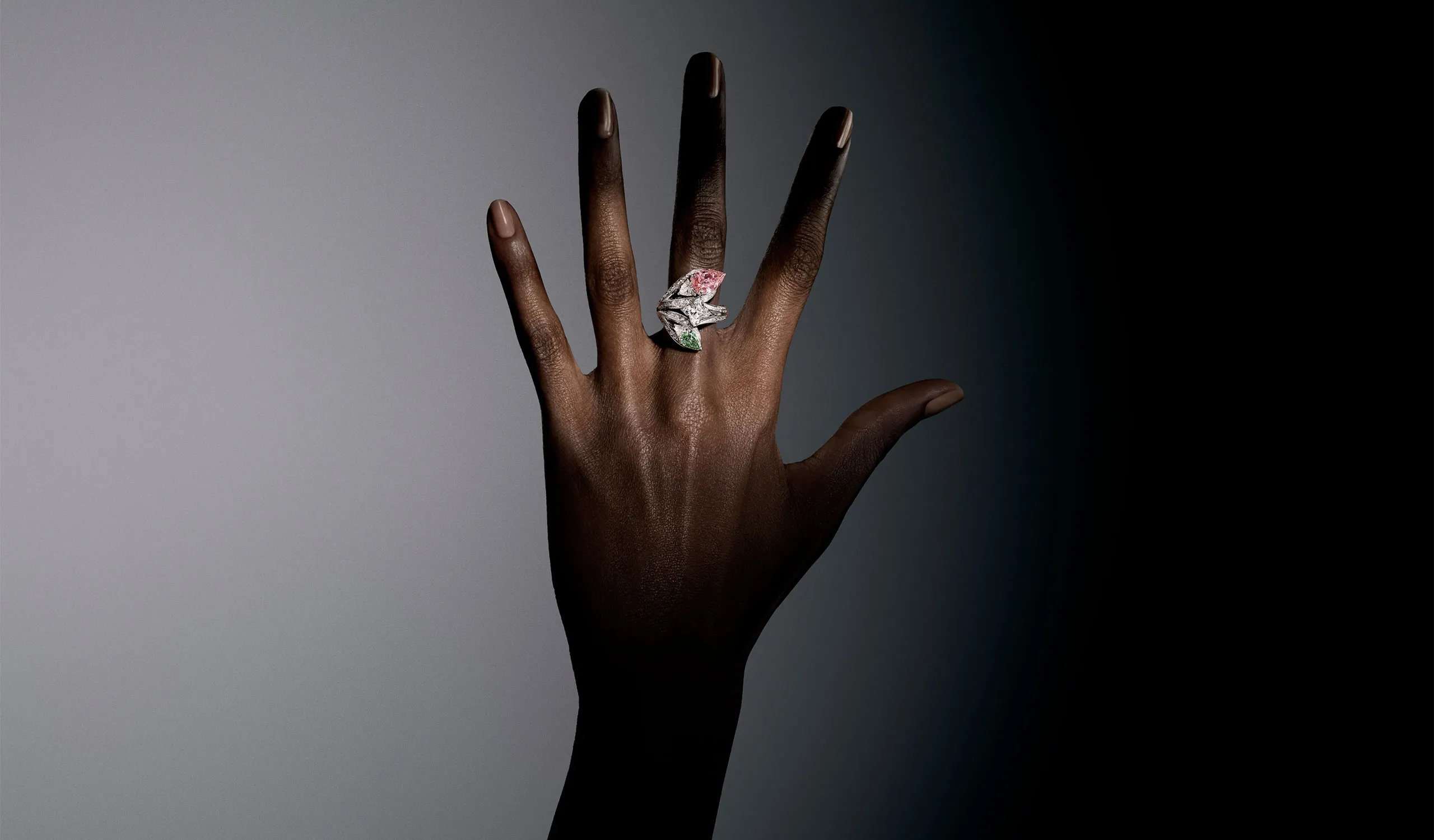 <p>The Victory ring, set with a 3.31ct Fancy Vivid pink pear-shaped diamond, a 1.01ct Fancy Intense Yellowish Green diamond and a 2.08ct LV Monogram Star cut diamond</p>

