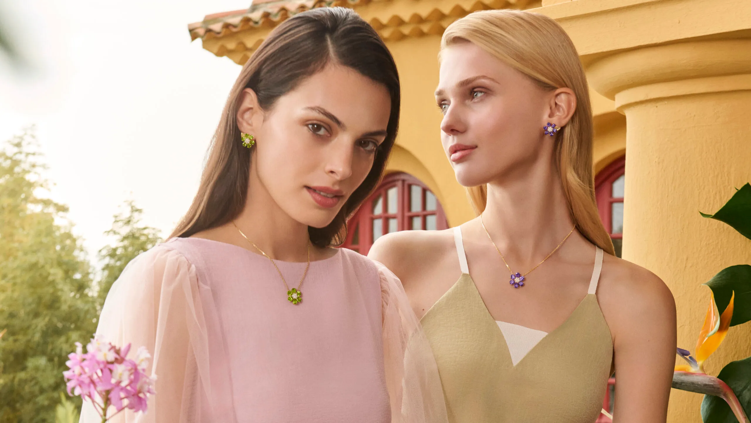 <p>Models wear Van Cleef & Arpels Fleurs d’Hawaï amethyst and peridot necklace and earrings, crafted with diamonds in 18k yellow gold</p>