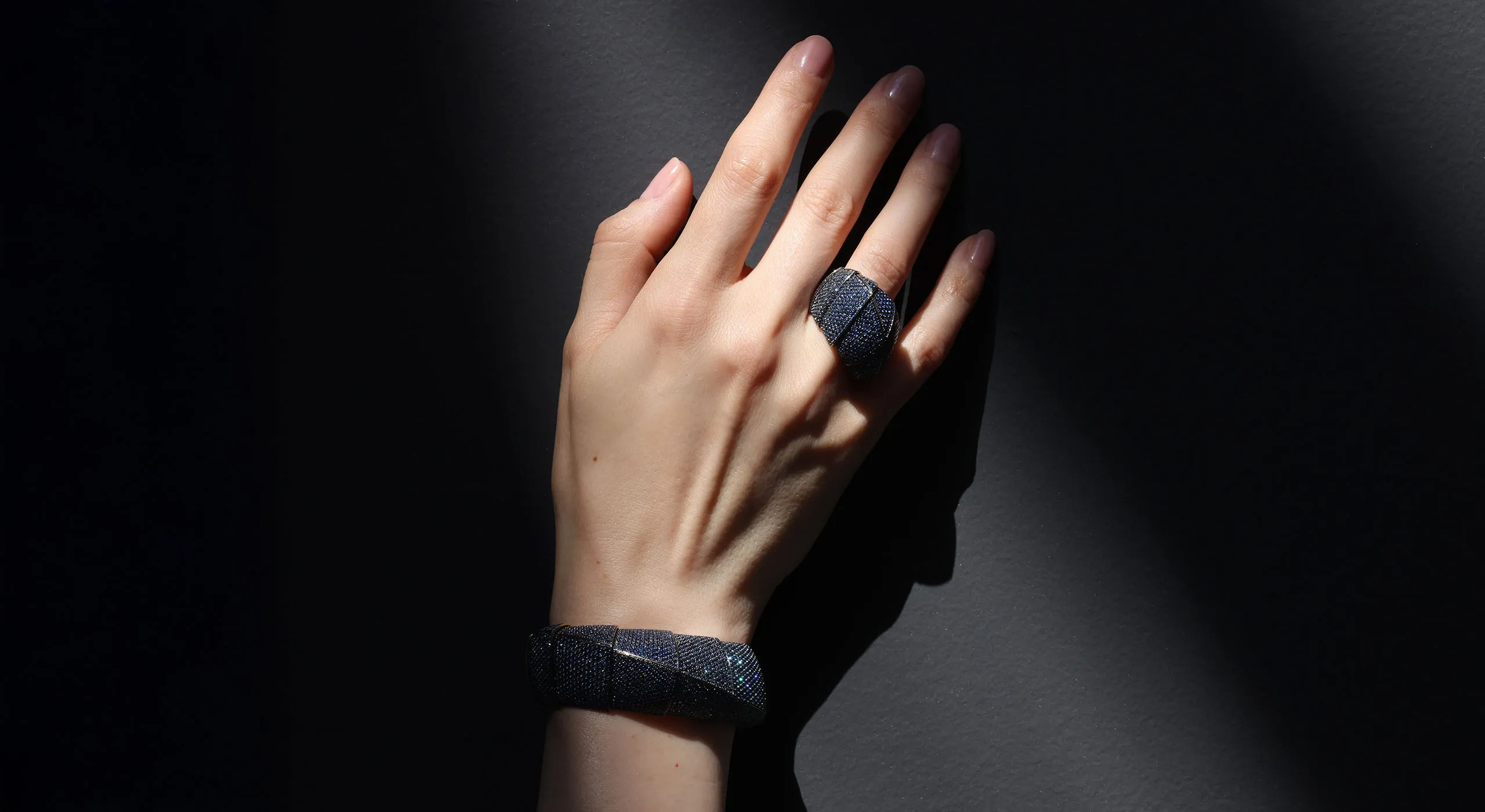 <p>Katerina Perez wears the Vhernier Profilo Di Stelle ring and matching bracelet from the Ardis High Jewellery collection, set with diamonds and sapphires in 18k white gold </p>
