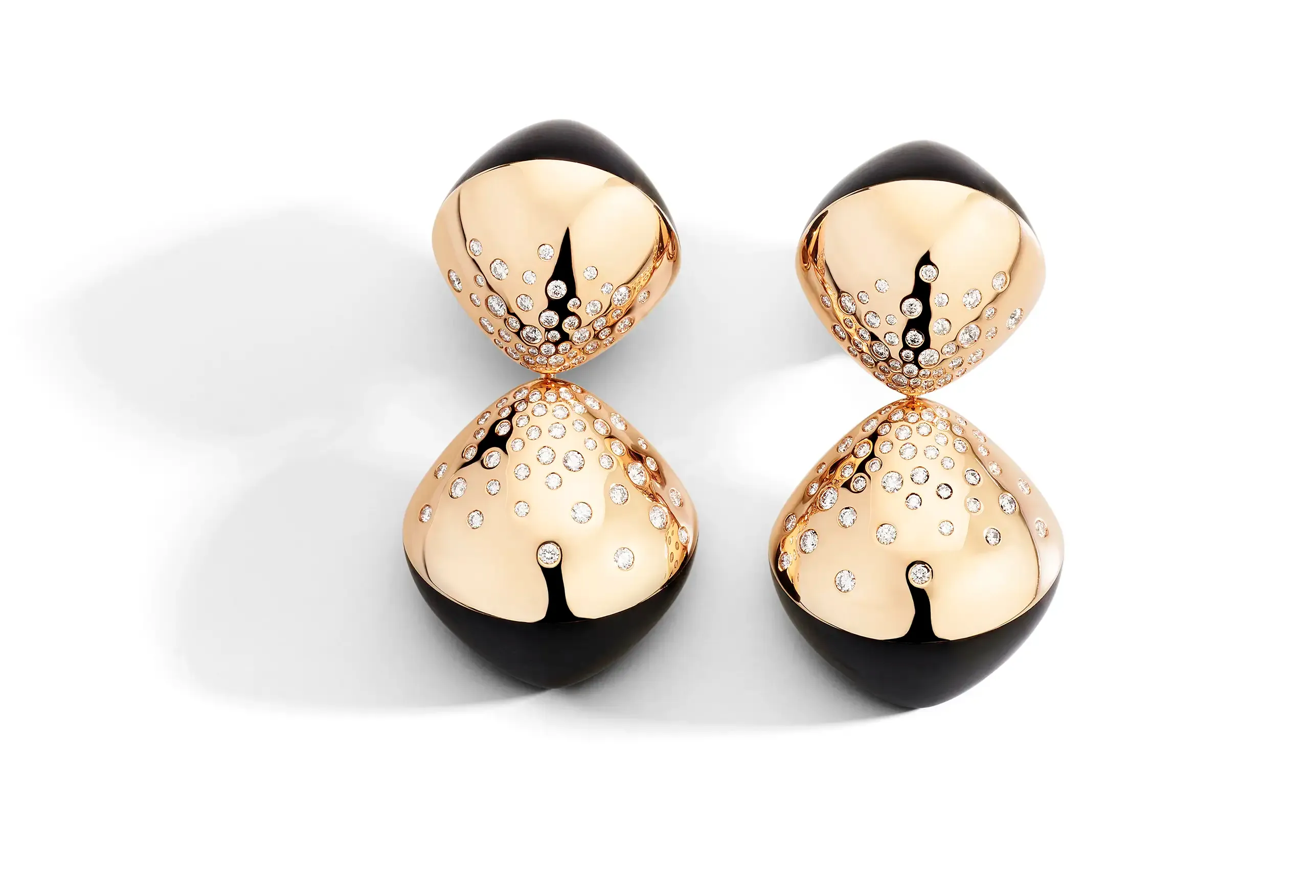 Inspired by the perpetual motion of a spinning top, Trottola explores balance through rounded volumes, contrasting materials and, tactile surfaces.