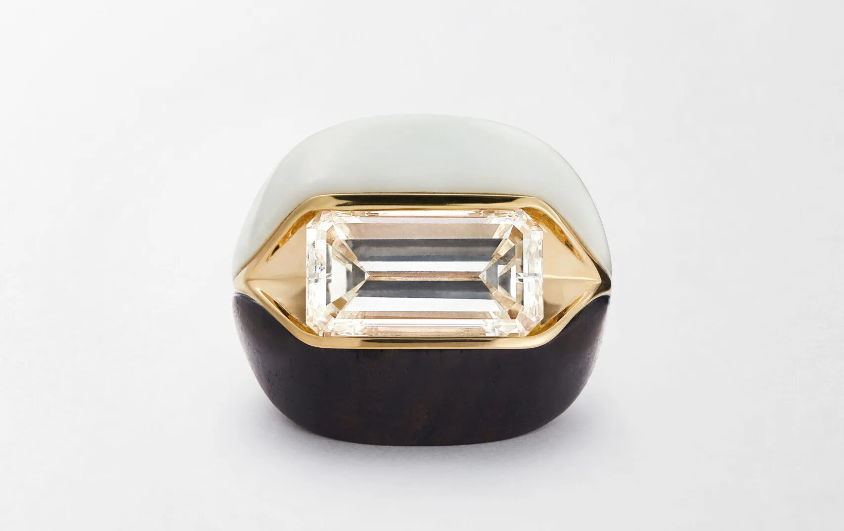 <p>Fernando Jorge High Armour ring in 18K yellow gold, set with an elongated emerald-cut diamond of approximately 7ct, white opal and ebony</p>
