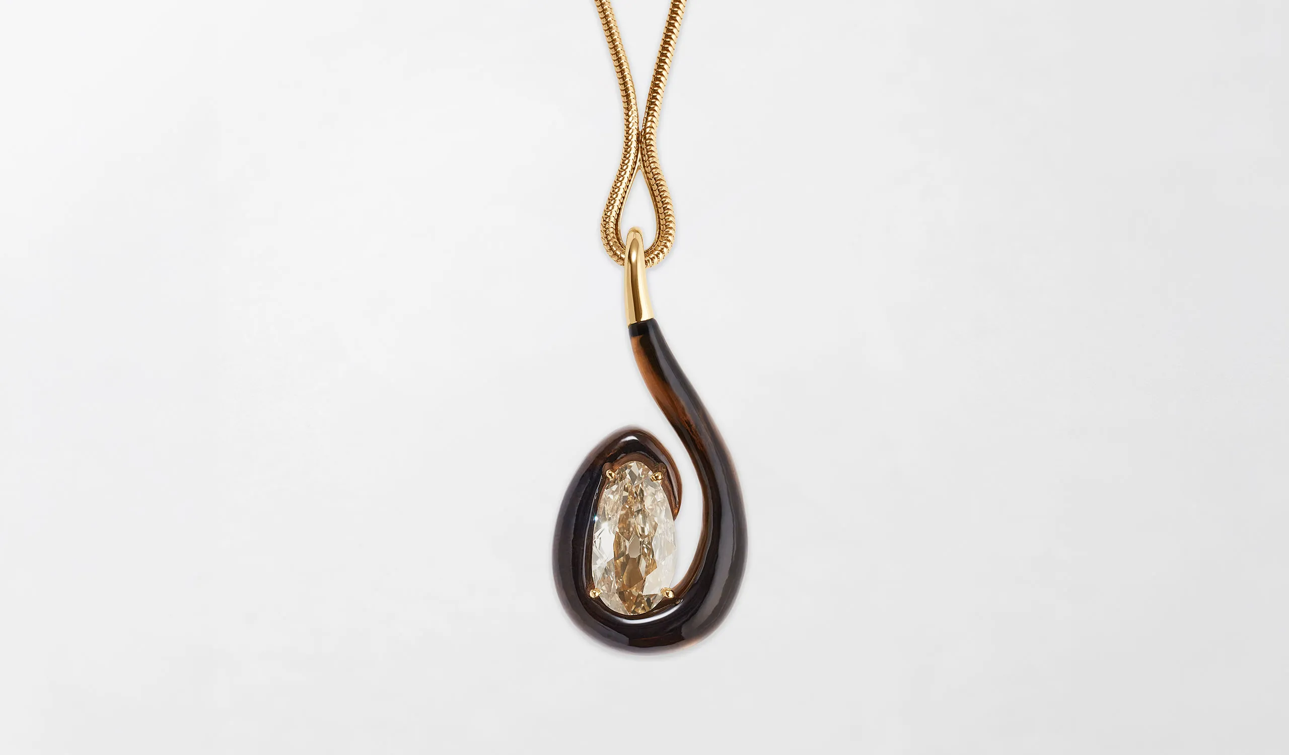<p>Fernando Jorge High Swirl diamond pendant in 18K yellow gold, set with a 7.08ct Old Mine-cut Fancy Yellow-Brown diamond and smoky quartz</p>
