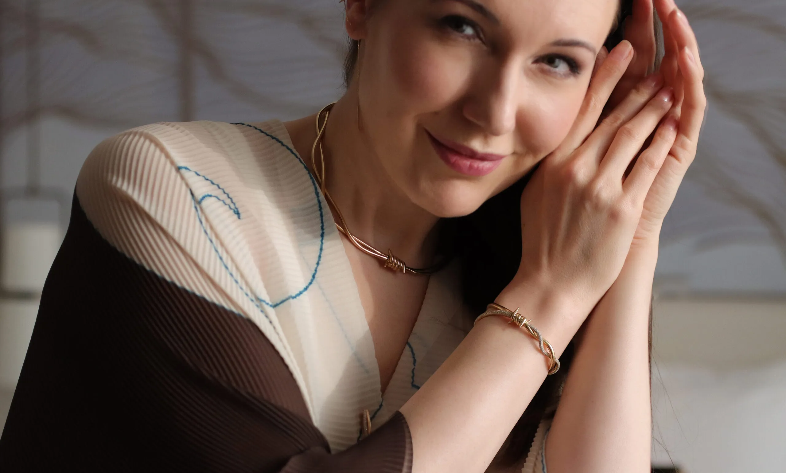 <p>Katerina wears the necklace and bracelet in 18k yellow gold with diamonds from the Wethaq collection by Moody Jewellery in Kuwait</p>