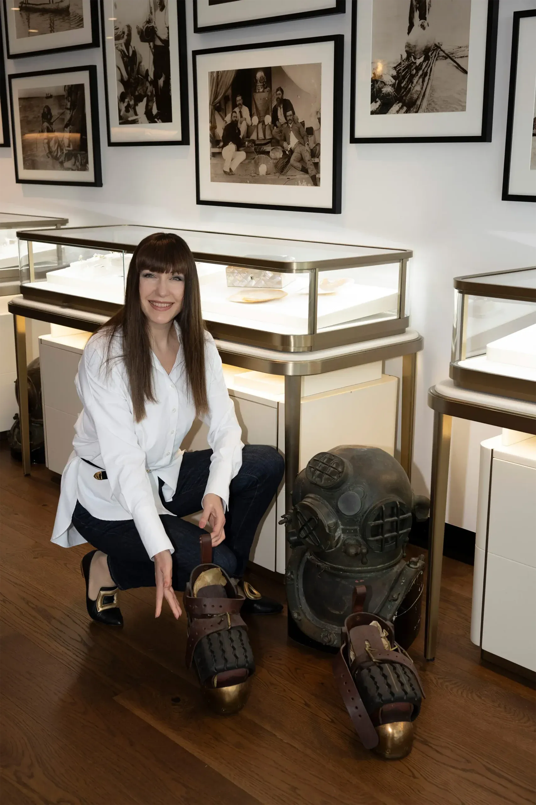 Katerina with antique pearl-diving equipment at the Autore showroom, a reminder of the family’s history in South Sea pearl farming