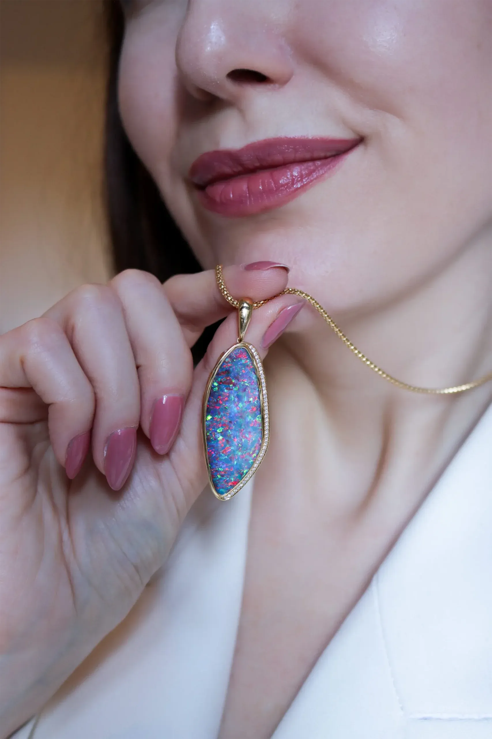 A 31.58-carat Australian boulder opal reveals a colourful Floral pattern in this one-of-a-kind pendant by Olivia Chan