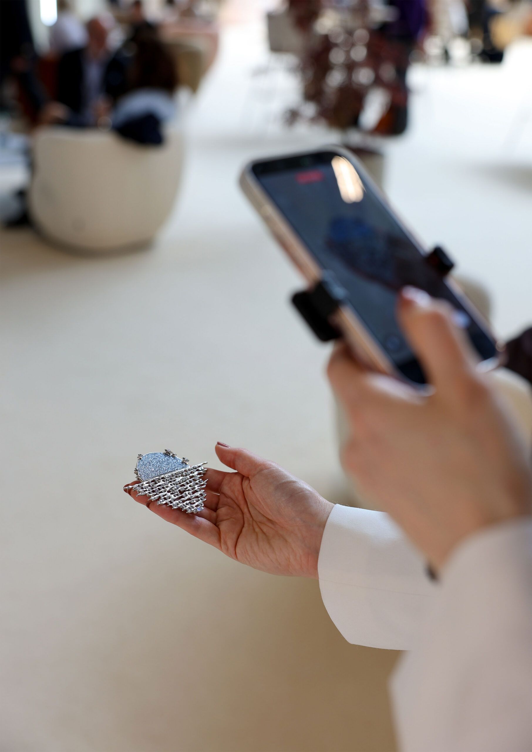2025 winner Bernadette Yodia’s Serenade of the Moon brooch, featuring a luminous osmium moon with diamond and sapphire accents