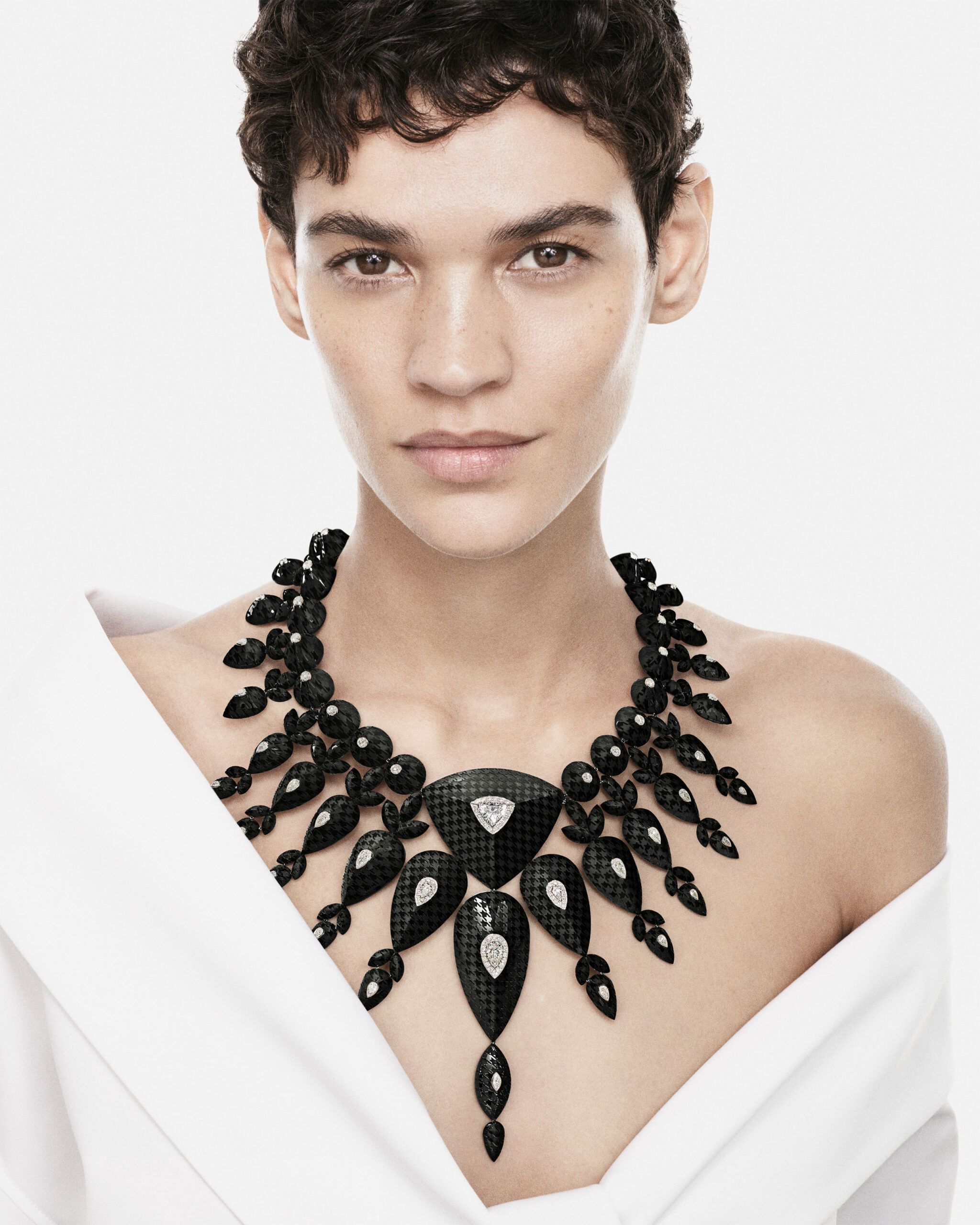 A model wears the Boucheron Checkers necklace with a 2.63-carat D-colour VVS1 trilliant-cut diamond, 1,535 carats of onyx and further diamonds in white gold from the Human Being Carte Blanche High Jewellery collection