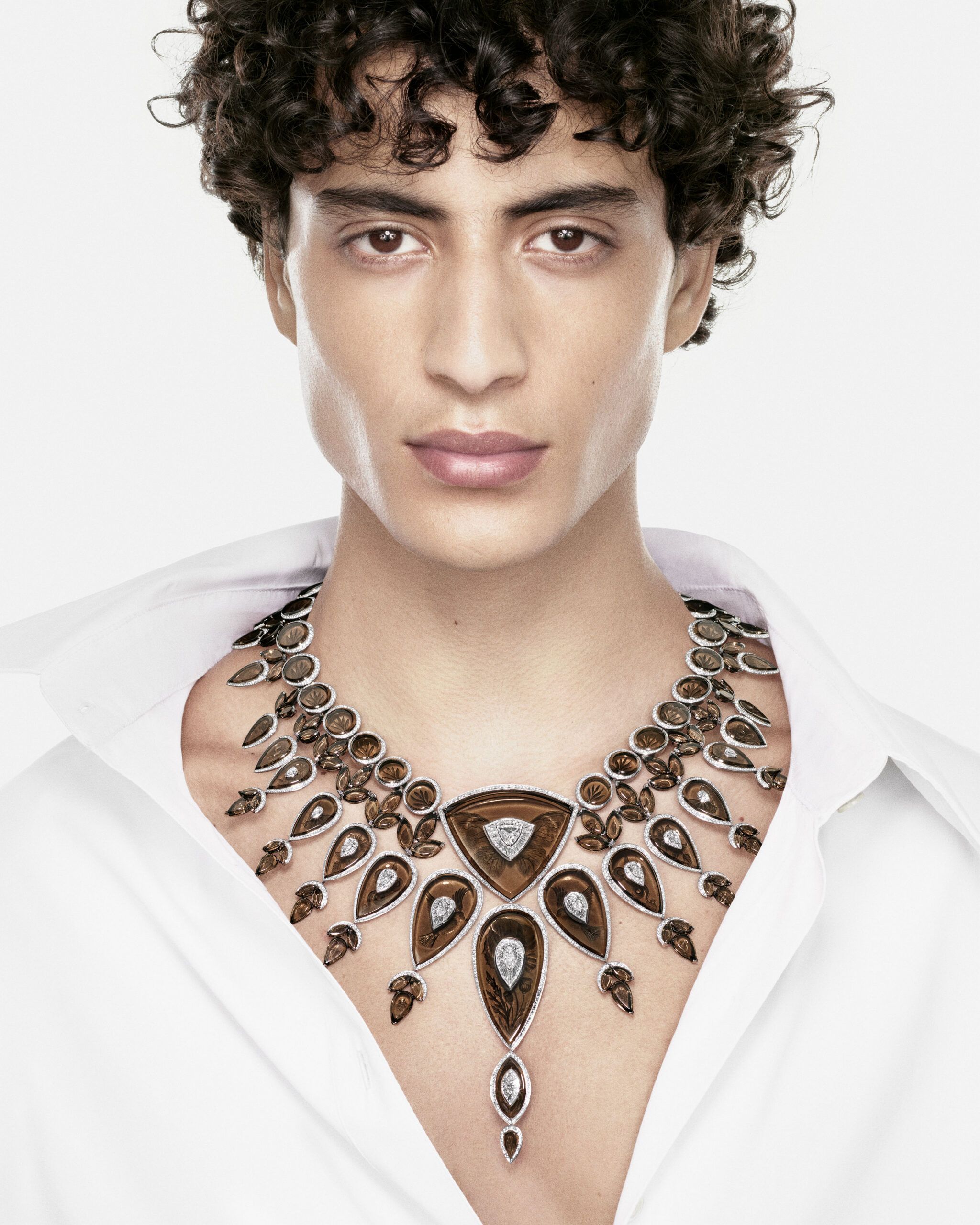 A model wears the Boucheron Tattoo necklace with a 1.74-carat D-colour, VVS1 trilliant-cut diamond, 580 carats of smoky quartz, and further diamonds in white gold from the Human Being Carte Blanche High Jewellery collection