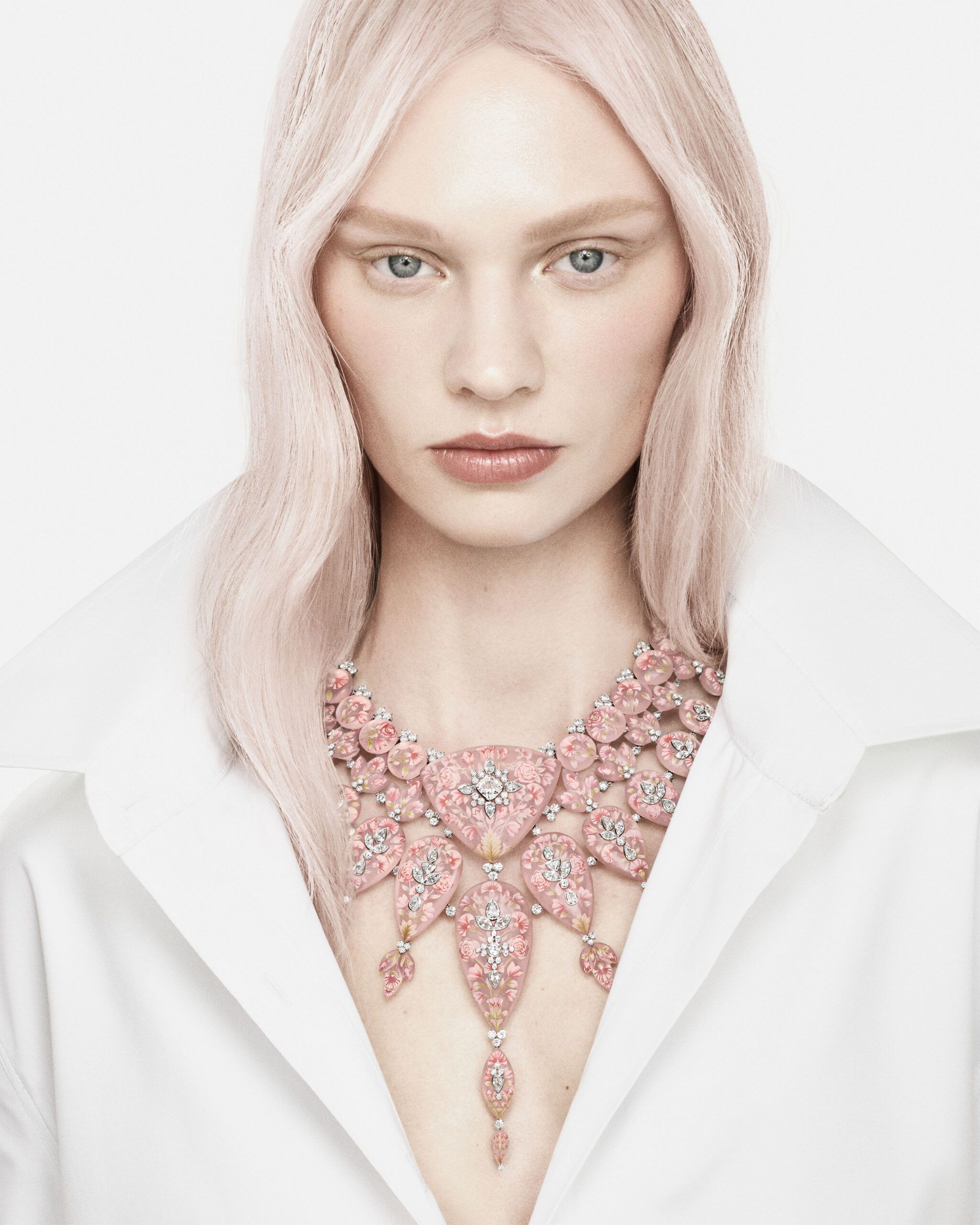 A model wears the Boucheron Flower necklace with a 3.26-carat, D-colour, VVS1 cushion-cut diamond, 1,532 carats of pink quartz, and further diamonds in pink gold, white gold and platinum from the Human Being Carte Blanche High Jewellery collection