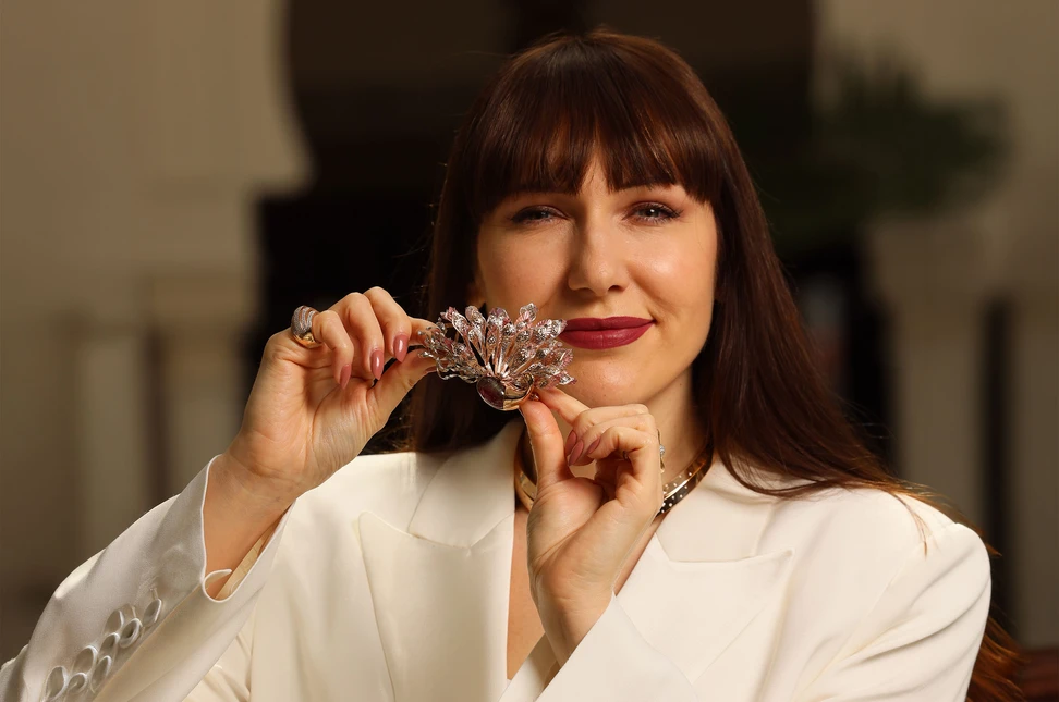 Katerina holds Bachtale’s fantastical gold, tourmaline and sapphire Peacock brooch, echoing the iconic embroidery of the Caftan Ntaa, a symbol of the ancient Imperial city of Fes