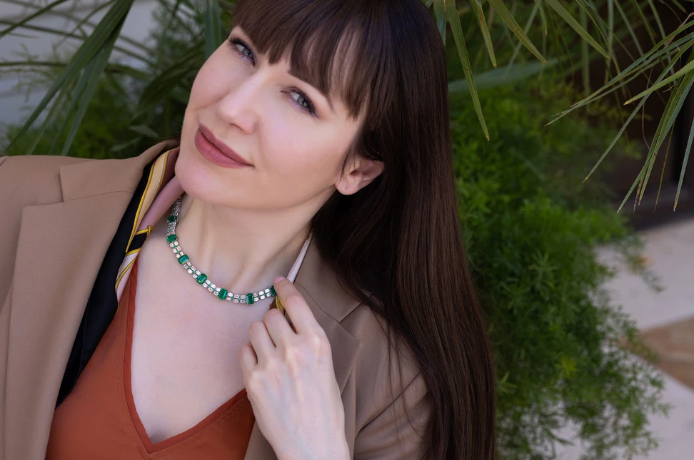 Katerina wears Bayco’s Colombian emerald necklace, whose strong emerald-cut geometry recalls the Art Deco architecture of the jeweller’s New York home