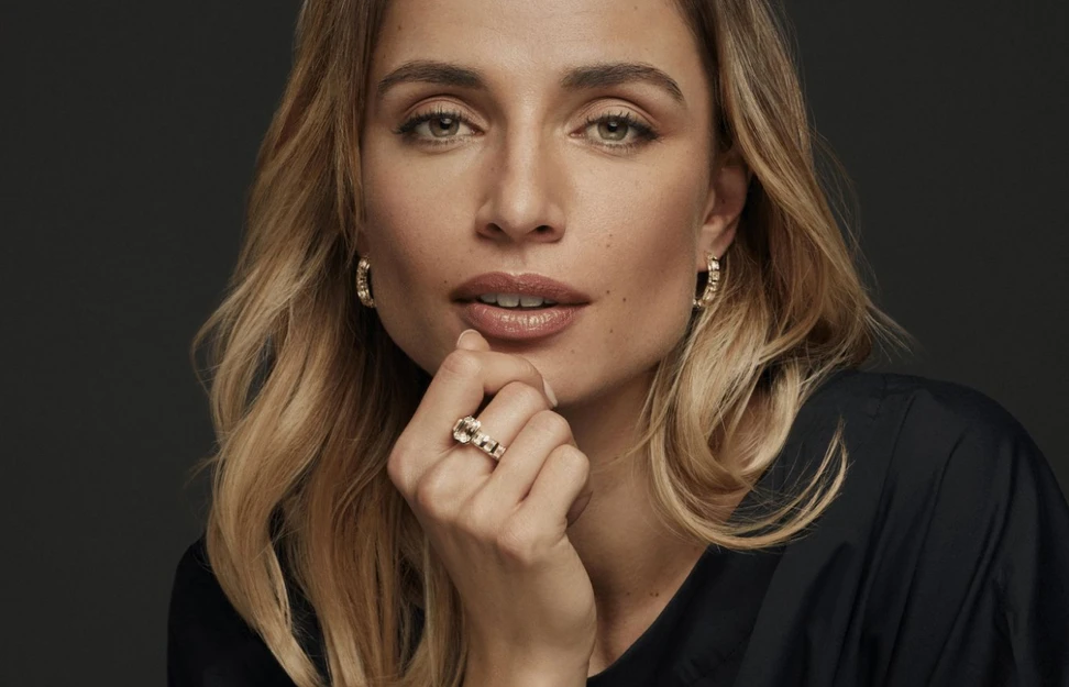 <p>A model wears a Schaffrath Paradoxal ring in 18k yellow gold with a 3.23 carat emerald-cut diamond, 5.45 carats of emerald-cut diamonds and 3.36 carats of round brilliant-cut diamonds, plus Paradoxal Creole earrings with 3.40 carats of Asscher-cut fancy yellow diamonds and round brilliant-cut white diamonds</p>
