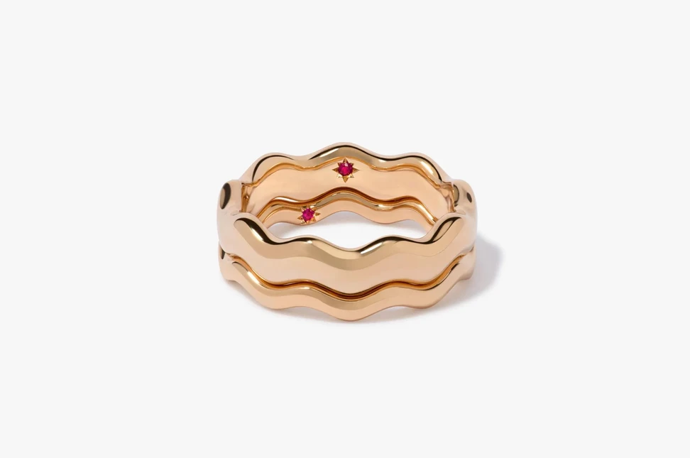 <p>Set with a tiny ruby inside symbolising love, Annoushka’s playful Whoopsie Daisy rings in 18K yellow gold are available in different widths.</p>