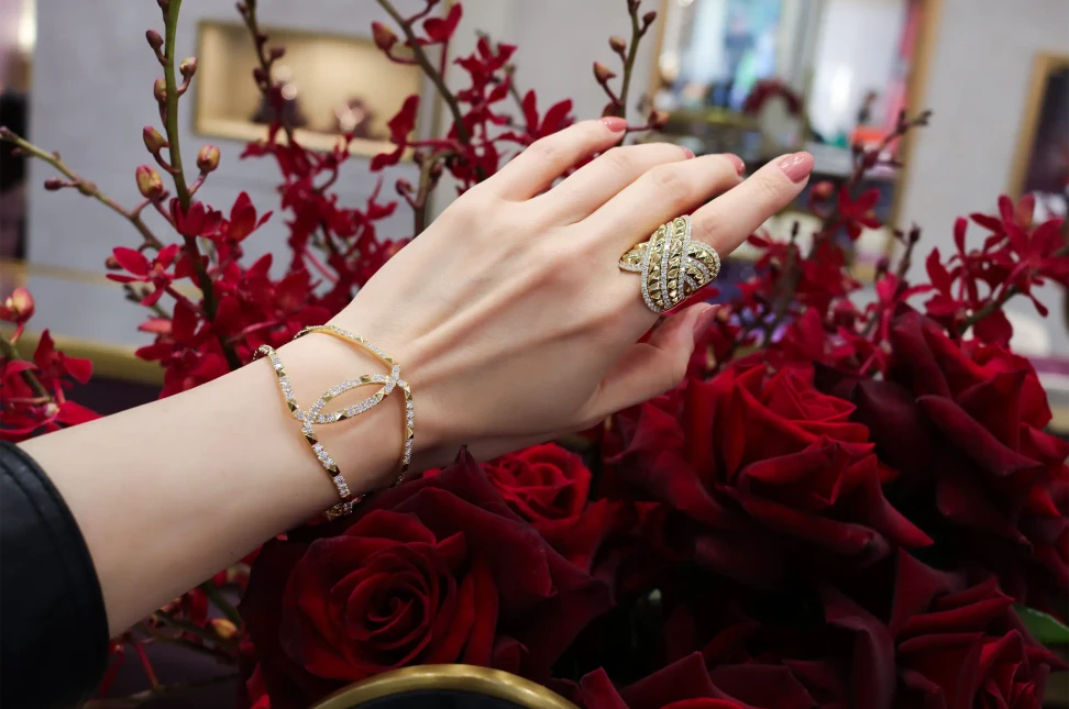 The R.08® Combat wrap ring and Echo bangle by ANTON Jewellery in 18k yellow gold, set with 2.24 and 4.46ct of diamonds respectively and featuring the collection’s signature geometric gold stud motif