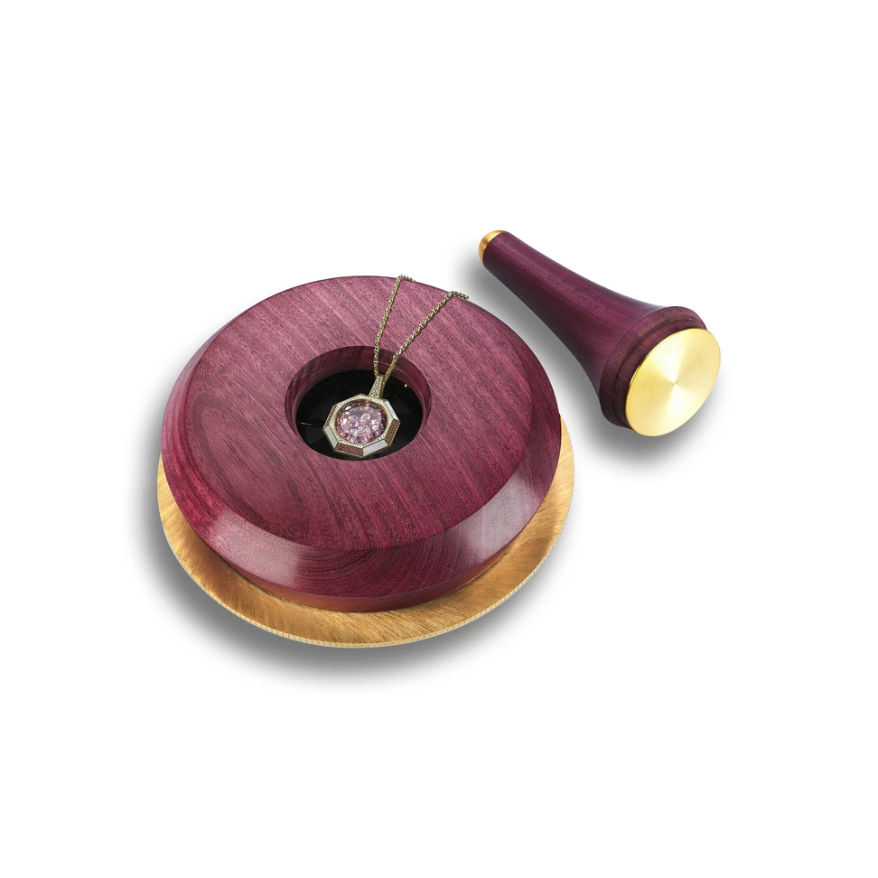 <p>The Aponine Gem Vault pendant requires a custom-made key crafted from rare purple heart wood to open</p>
