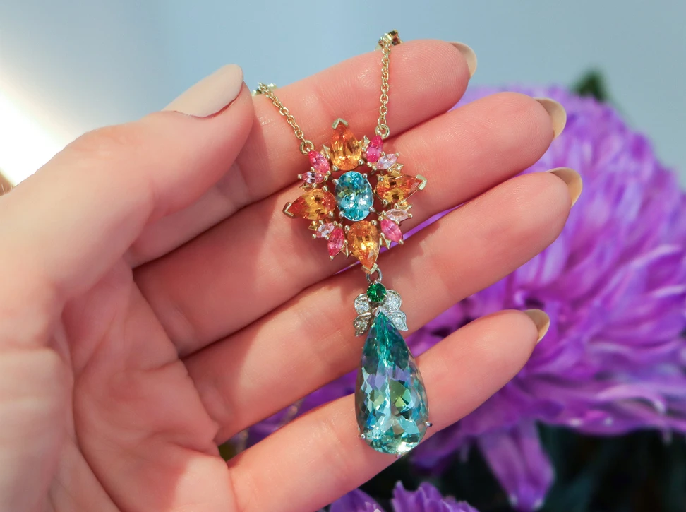Artisans Bespoke Jewellers Botanica necklace composed of sapphire, garnet, spinel, zircon and diamond with a detachable aquamarine, zircon and diamond drop, set in 18k yellow and white gold 