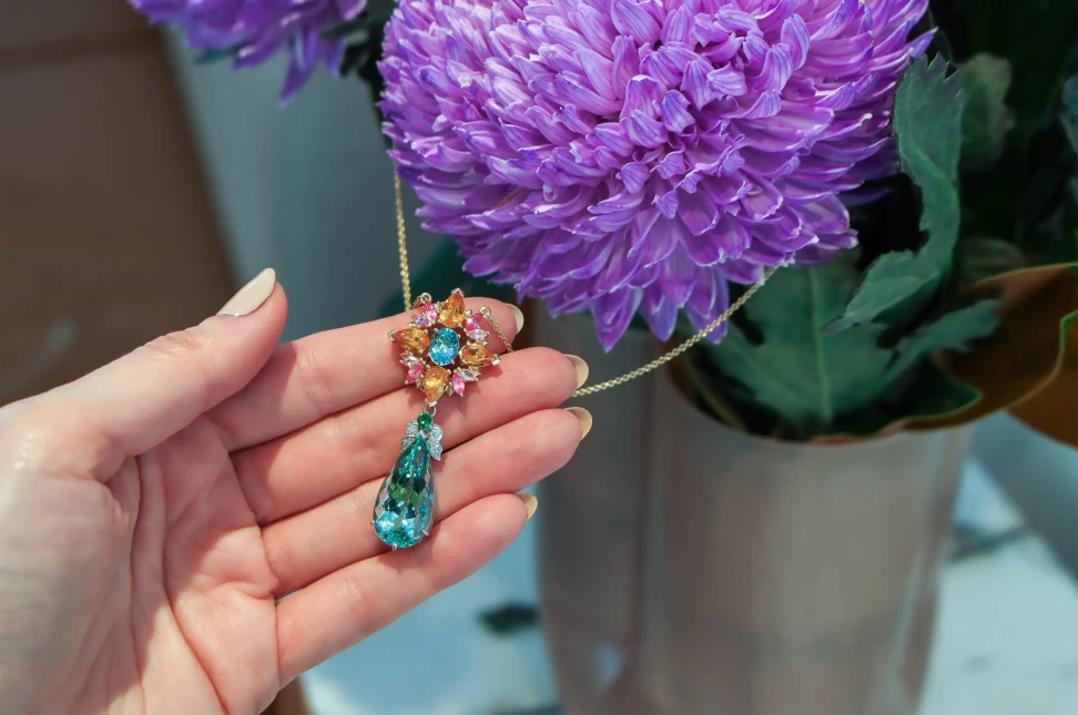 Artisans Bespoke Jewellers Botanica necklace composed of sapphire, garnet, spinel, zircon and diamond with a detachable aquamarine, zircon and diamond drop, set in 18k yellow and white gold 