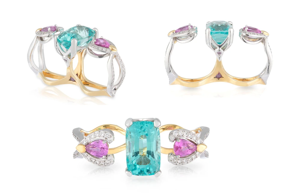Artisans Bespoke Jewellers Elysian two-finger ring with a 9.84 carat cushion-cut aquamarine, pear-shaped Ceylon pink sapphires, grain-set round brilliant-cut diamonds and round brilliant-cut treated purple diamonds in the shank, crafted in 18k yellow and white gold