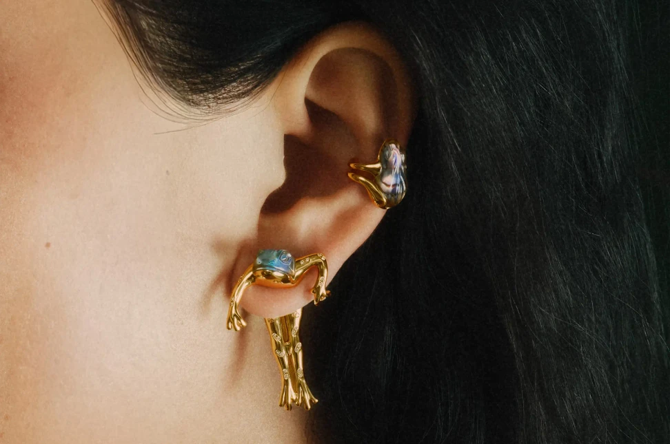 A frog's long limbs clamber over rings, earrings and necklaces in Bibi van der Velden's Enchanted Forest collection