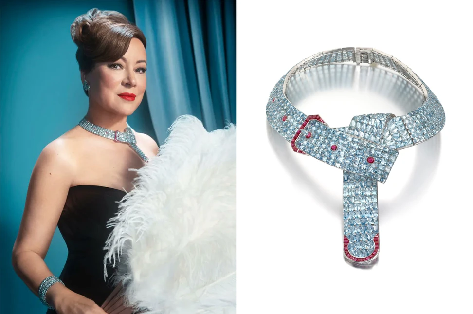 The actress Jennifer Tilly wearing the iconic aquamarine and ruby Belt Buckle necklace by Paul Flato - one of the most important jewels in her personal collection
