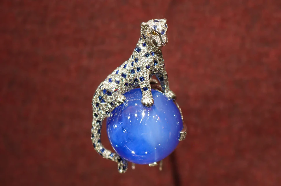 Cartier Panthère clip brooch, 1949, created for the Duchess of Windsor, with a diamond and sapphire panther perched on a 152.35-carat Kashmir sapphire cabochon