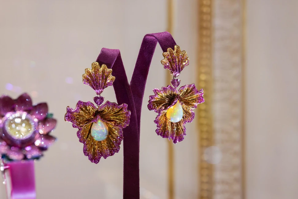 <p>Chopard Flower earrings with 18.09 carats of opal cabochons, two heart-shaped pink sapphires totalling 3.28 carats, pink sapphires of 6.84 carats, yellow sapphires of 3.41 carats and 1.74 carats of orange brilliant-cut sapphires, alongside ruby and diamonds in titanium, part of the Caroline’s Universe Red Carpet High Jewellery Collection 2025</p>