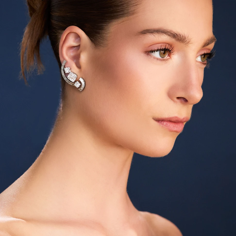 The Arc earrings by Creations Jewellers, winner of the Diamonds Reimagined award. They were created from a client's existing tennis bracelet, ring and bangle