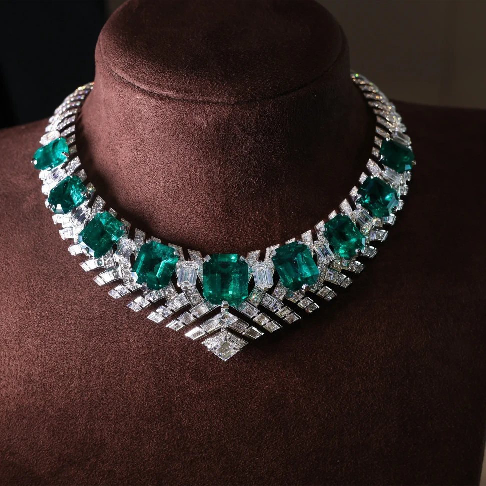 Nine Colombian emeralds totalling 98.35 carats form a line of rare colour through the David Morris Kalamos necklace