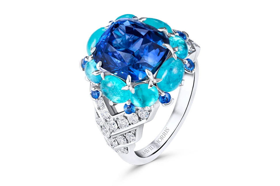 The David Morris Pura ring builds a spectrum of blue around a 7.08-carat unheated Sri Lankan sapphire, with cabochon Paraiba tourmalines and cobalt spinels