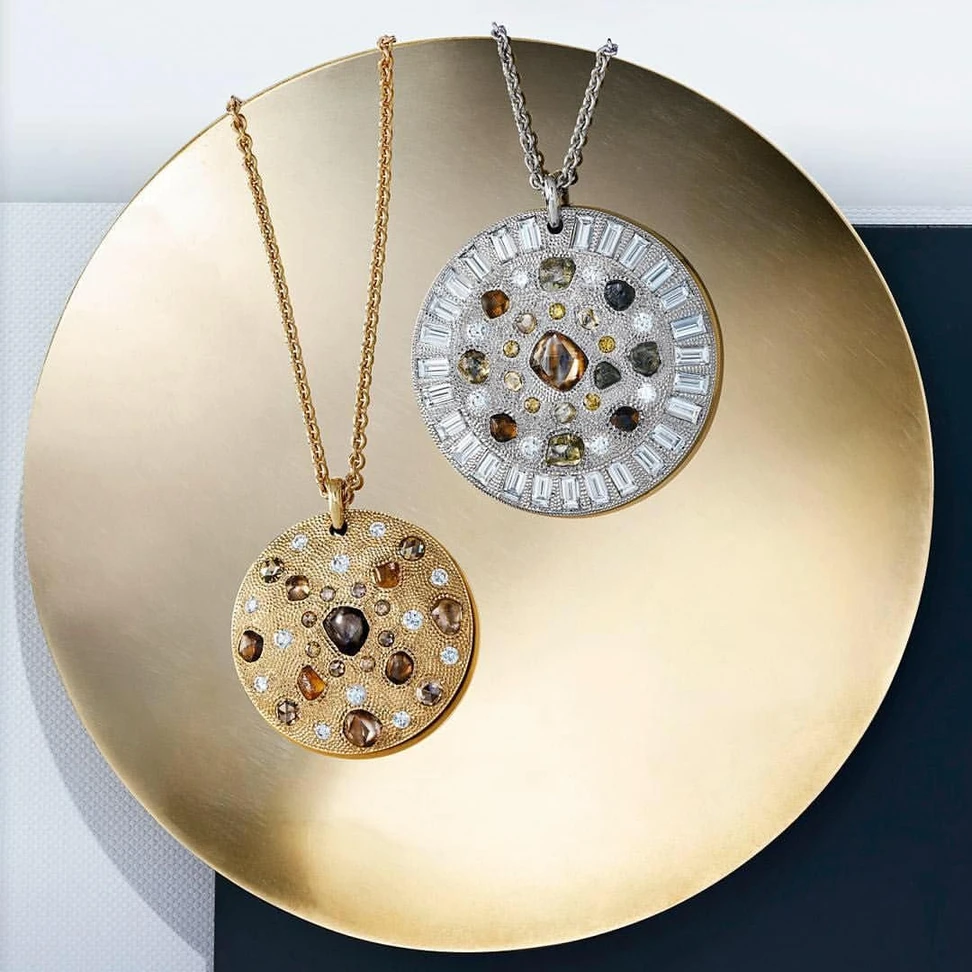 <p>De Beers Talisman collection pendants with rough diamonds</p>