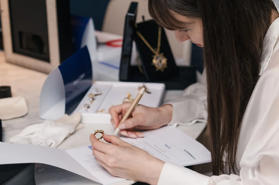 Katerina Perez examines one of the entries during the judging of the 9th Diamond Guild Australia Jewellery Awards