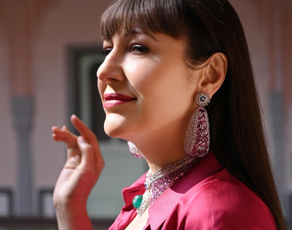 <p>Katerina Perez wears unique High Jewellery masterpieces from the Diviano One Collection, including a necklace with 37 carats of carved Colombian emerald, 4 carats of Ceylon sapphires, 130 carats of pink sapphires, and 65 carats of rose-cut diamonds </p>