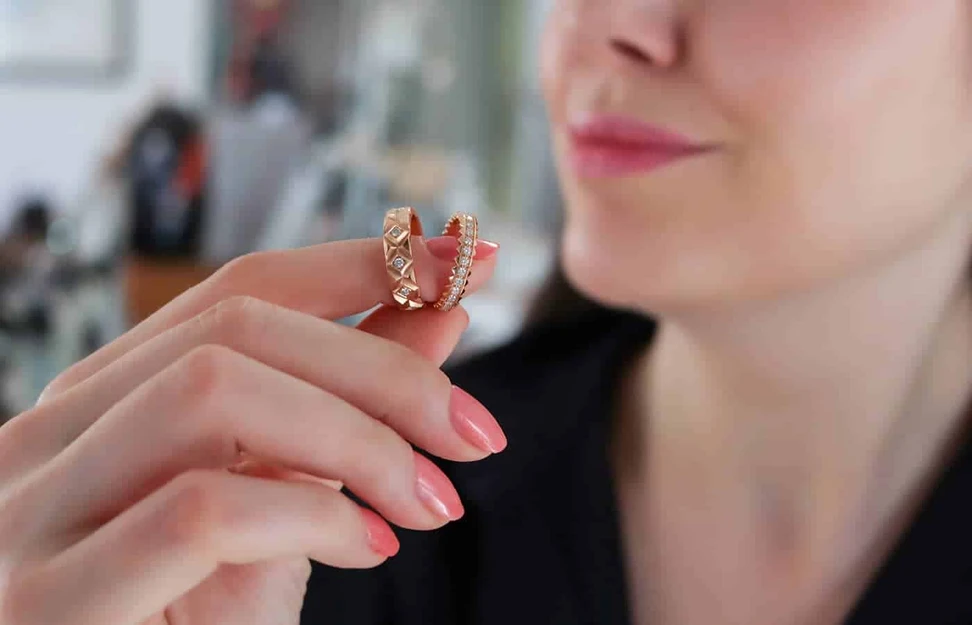 <p>Ferrat Paris Triomphe wedding ring (left) and the Don’t Take Me For Granted Alliance ring, both with diamonds in rose gold</p>