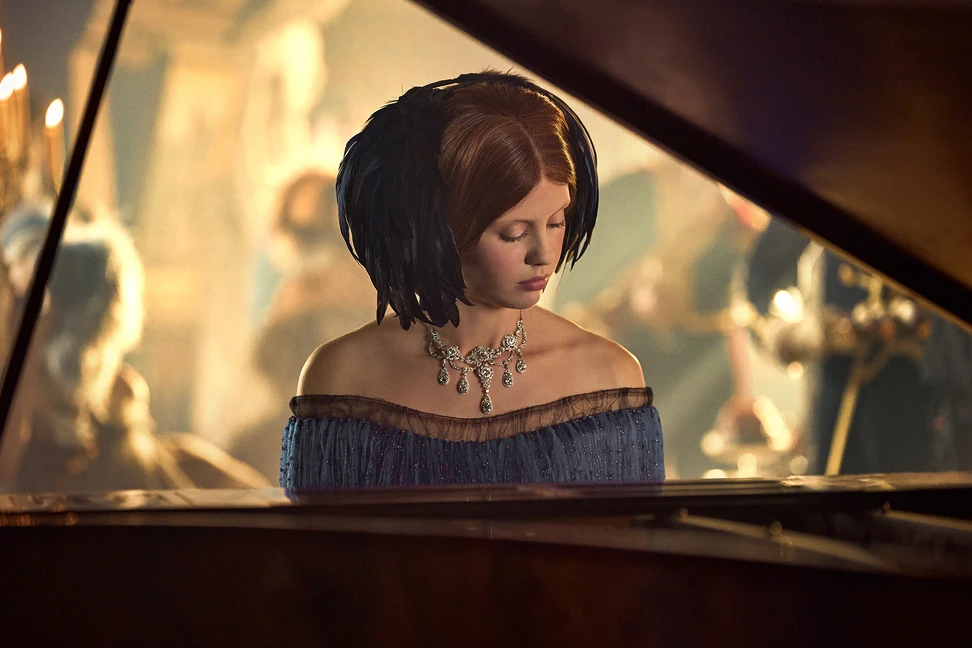 <p>Mia Goth as Elizabeth Lavenza wearing the Wade Necklace, a garland-style diamond jewel circa 1900, created by legendary Tiffany designer Paulding Farnham</p>