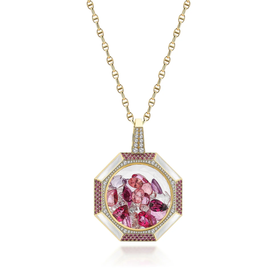<p>Aponine Gem Vault pendant with diamonds, pink sapphires, mother-of-pearl inlay and a pink, raspberry and lilac mix of fancy-cut gems inside a transparent quartz cage</p>
