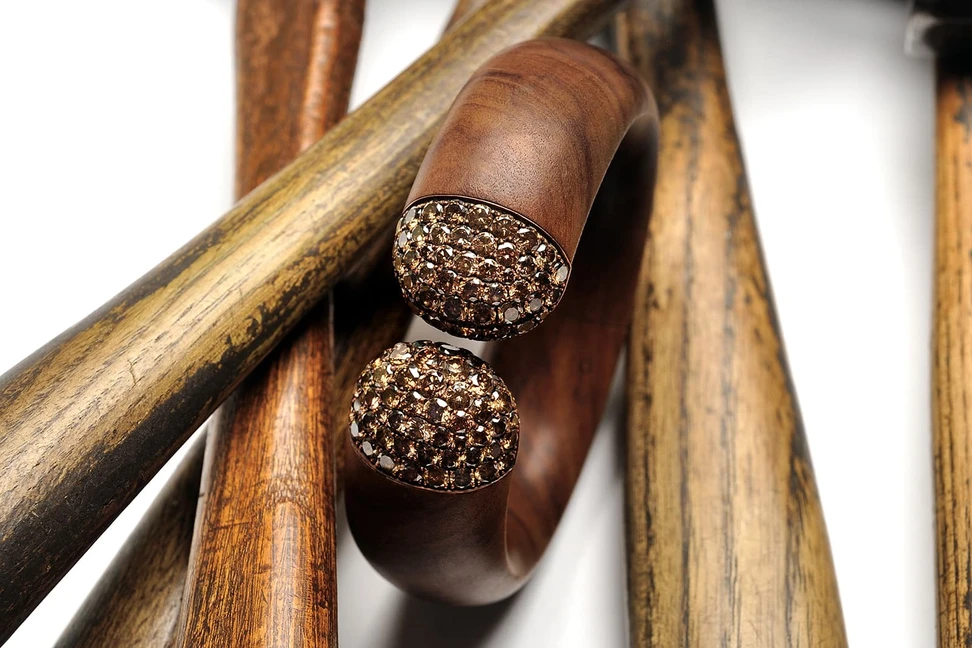 <p>Hemmerle Harmony bangle with brown diamonds, wood, copper and white gold, private collection, courtesy Hemmerle</p>