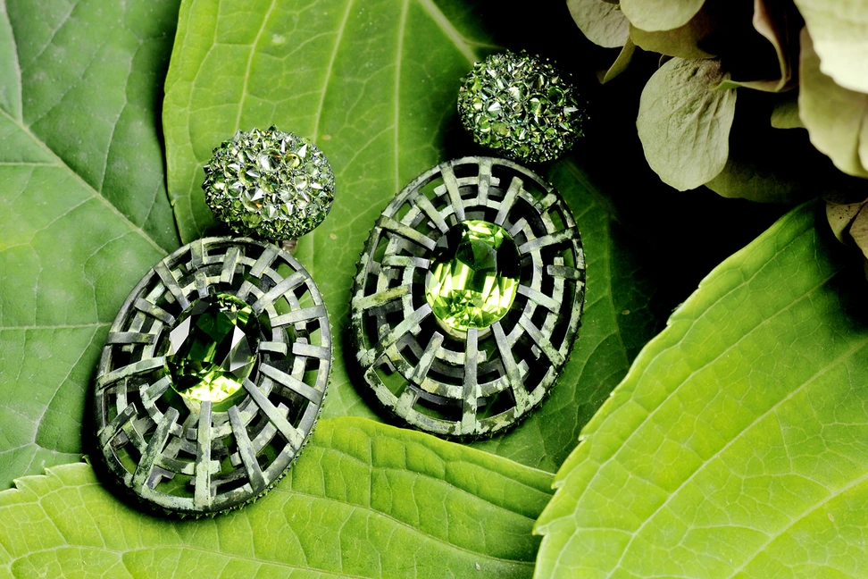 <p>Hemmerle earrings with demantoids, peridots, white gold, silver courtesy of Hemmerle</p>