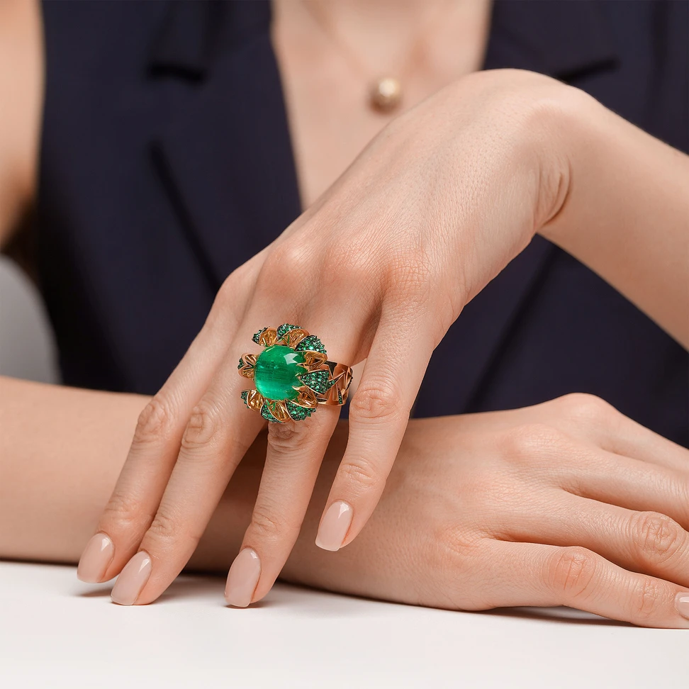 <p>IDORO Cactus ring with a 12.03 carat Ural emerald cabochon with a cat’s eye effect, surrounded by 104 emeralds in blackened 18k yellow gold</p>
