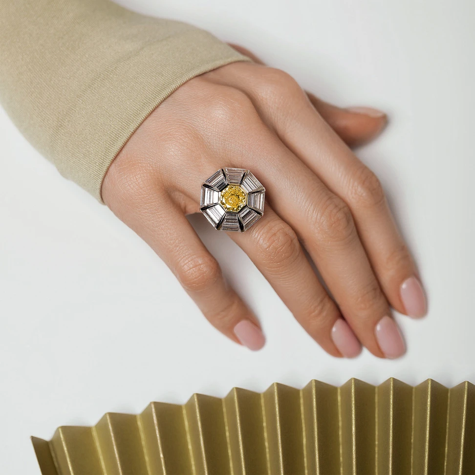 <p>IDORO Chamomile ring with a 2.66 carat fancy intense orangey yellow octagon-shaped diamond, 24 step-cut white diamonds, and 120 further diamonds</p>
